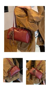 Retro dark red PU leather bowling shoulder bag with cute charm details for women daily commuting.