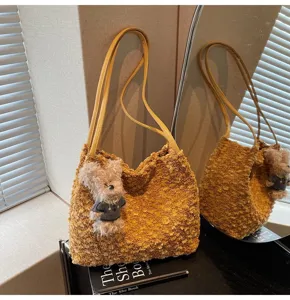 Retro Maillard plush shoulder bag for women, cute fluffy tote bag with bear pendant design.