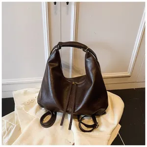 Dark brown PU leather backpack and shoulder bag for women, stylish large capacity commuter.