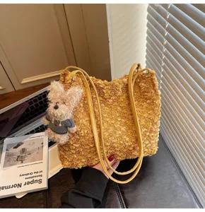 Close-up detail of the retro fluffy brown tote bag featuring a cute plush dog keychain charm.