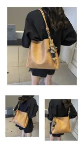 Details of the stylish large capacity bucket shoulder bag with cute rabbit pendant for women.