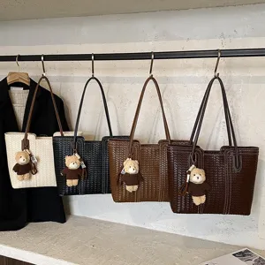 Vintage woven tote bag with cute bear pendant, large capacity shoulder bag for women.