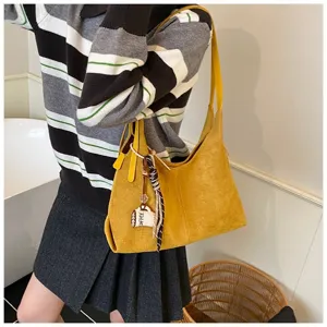 Stylish yellow suede shoulder bag for women, large capacity commuter tote and handbag.