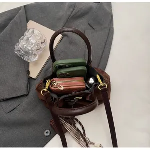 Retro brown top handle crossbody bag detail view showing interior capacity and stylish design