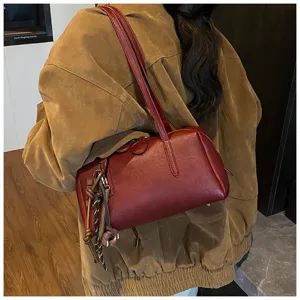 Retro red PU bowling shoulder bag for women, stylish vintage underarm pillow bag daily use.
