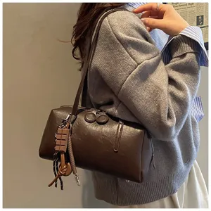 Vintage brown PU leather bowling shoulder bag, chic underarm pillow bag for women daily commute.