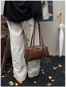 Retro PU leather bowling shoulder bag for women, stylish vintage underarm pillow bag.