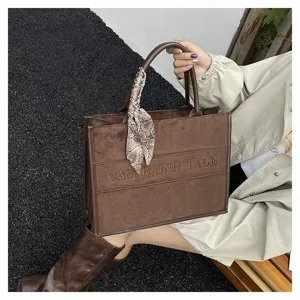 Brown suede tote bag with stylish silk scarf and letters, large capacity handbag for daily wear.