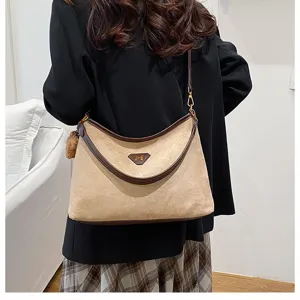Stylish suede shoulder bag for women, large capacity hobo bag with contrast trim and chic charm.