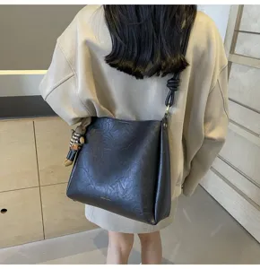 Black PU leather large capacity shoulder bucket bag with cute hanging charm detail