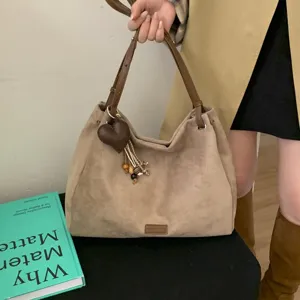 Stylish vintage suede hobo shoulder bag for women, large capacity daily commuting bag.