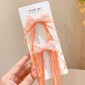 Bonitas horquillas de lazo naranja con cintas largas para niñas, accesorios de pelo adorables.
