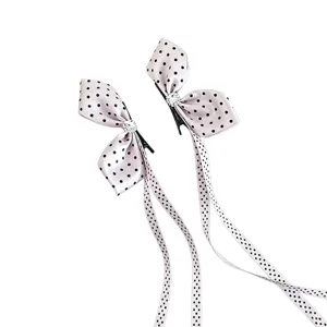 Bonita pinza de pelo de lazo con lunares rosas y diamantes de imitación para niños.
