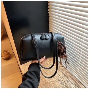 Classic black PU leather bowling bag, stylish vintage shoulder underarm handbag for women.