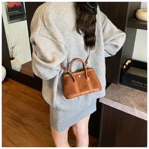 Retro suede patchwork shoulder bag for women, elegant vintage tote handbag with top handle.