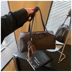 Retro PU leather bowling bag, stylish underarm shoulder pillow bag for women daily commuting.