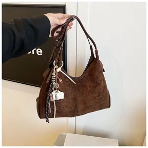 Brown suede shoulder bag detail view, large capacity vintage handbag with cute coffee cup charm.