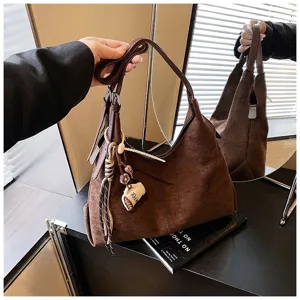 Detailed view of the retro brown suede hobo shoulder bag, featuring soft texture and large capacity.