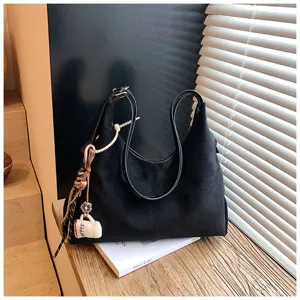 Detailed view of the autumn winter retro large capacity black suede shoulder hobo bag.