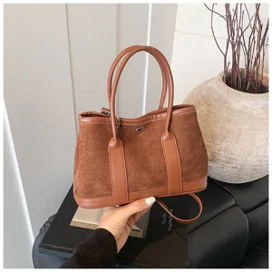 Retro suede patchwork tote shoulder bag detail view showing fine texture and leather trim.
