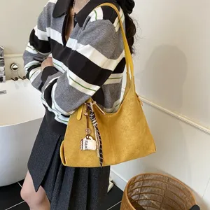 Stylish retro yellow suede shoulder bag for women, large capacity casual hobo handbag.