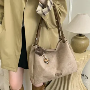Vintage suede shoulder bag for women, large capacity commuter tote bag with cute heart charm.