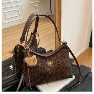 Trendy leopard print shoulder bag for women, large capacity suede tote bag with cute bear charm.
