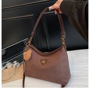 Brown suede shoulder bag for women, large capacity tote and stylish niche underarm bag.