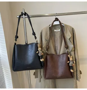 Stylish large-capacity autumn winter commuter shoulder bag bucket bag with rabbit charm.
