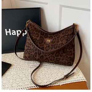 Leopard print shoulder bag detail view, soft velvet texture, chic brown crossbody strap design.