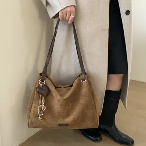 Retro suede shoulder bag for women, large capacity commuter tote and casual crossbody bag.