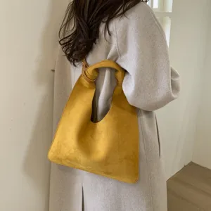 Chic yellow suede hobo shoulder bag, retro slouchy casual tote for women autumn daily commute.