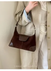 Detailed view of vintage brown suede and PU spliced shoulder bag, elegant autumn retro style.