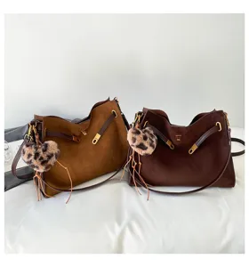 Retro suede tote bag for women, large capacity shoulder handbag with chic leopard heart charm.