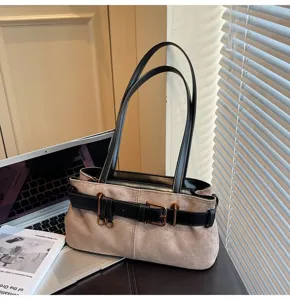 Vintage suede shoulder bag for women, casual commuter underarm handbag with decorative belt.