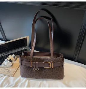 Vintage leopard print suede shoulder bag detail, casual women tote bag with metal buckle.