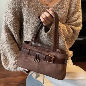 Retro brown suede handbag for women, casual commuting shoulder underarm bag with belt detail.