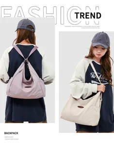 Detail view of large capacity casual canvas shoulder bag, versatile convertible design.
