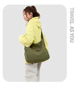 Japanese minimalist women's shoulder bag, large capacity casual canvas crossbody tote for daily travel.