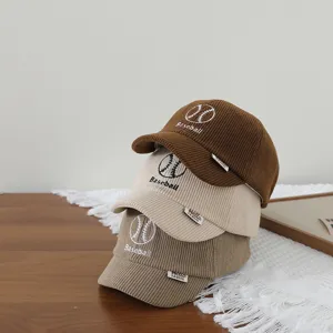 Corduroy baseball cap for kids, short brim, cute embroidered design, perfect autumn item.