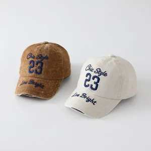 Details of retro washed embroidered letter baseball cap with chic style and number 23 design.