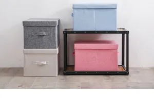 Foldable fabric storage box with lid, linen cloth organizer for clothes and wardrobe details.