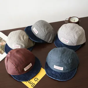 Kids plaid baseball cap with folded brim and cute label, comfortable outdoor sun hat for spring.