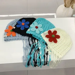 Handmade crochet hollow flower knit beanie hat with long tassels, breathable summer headwear.