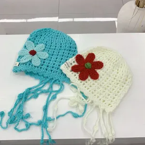 Handmade crochet hollow flower knit beanie hat detail view, breathable summer design with cute strings.