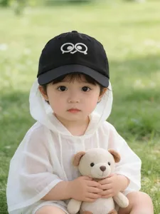Cute toddler baseball cap detail, featuring funny big eyes embroidery, soft fabric for summer.