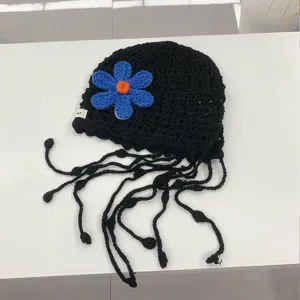 Handmade crochet hollow flower black knit beanie hat with cute hanging tassels for women