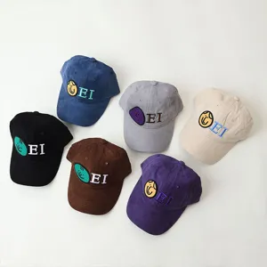 Detail view of children's corduroy baseball caps in multiple colors with EI embroidery.
