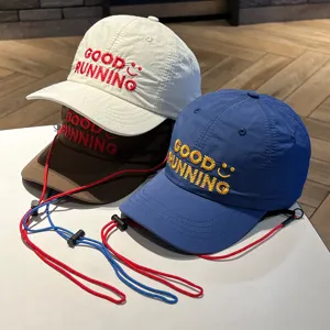 Detailed view of kids quick-dry baseball caps featuring embroidery text and windproof ropes.