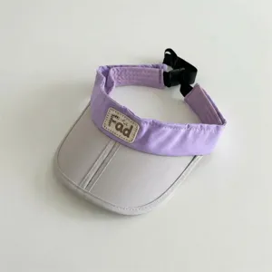 Detailed close-up view of the kids colorblock empty top sun visor with adjustable strap.